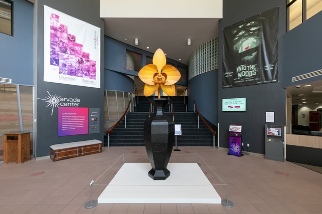 A statue of a wooden flower in our main lobby